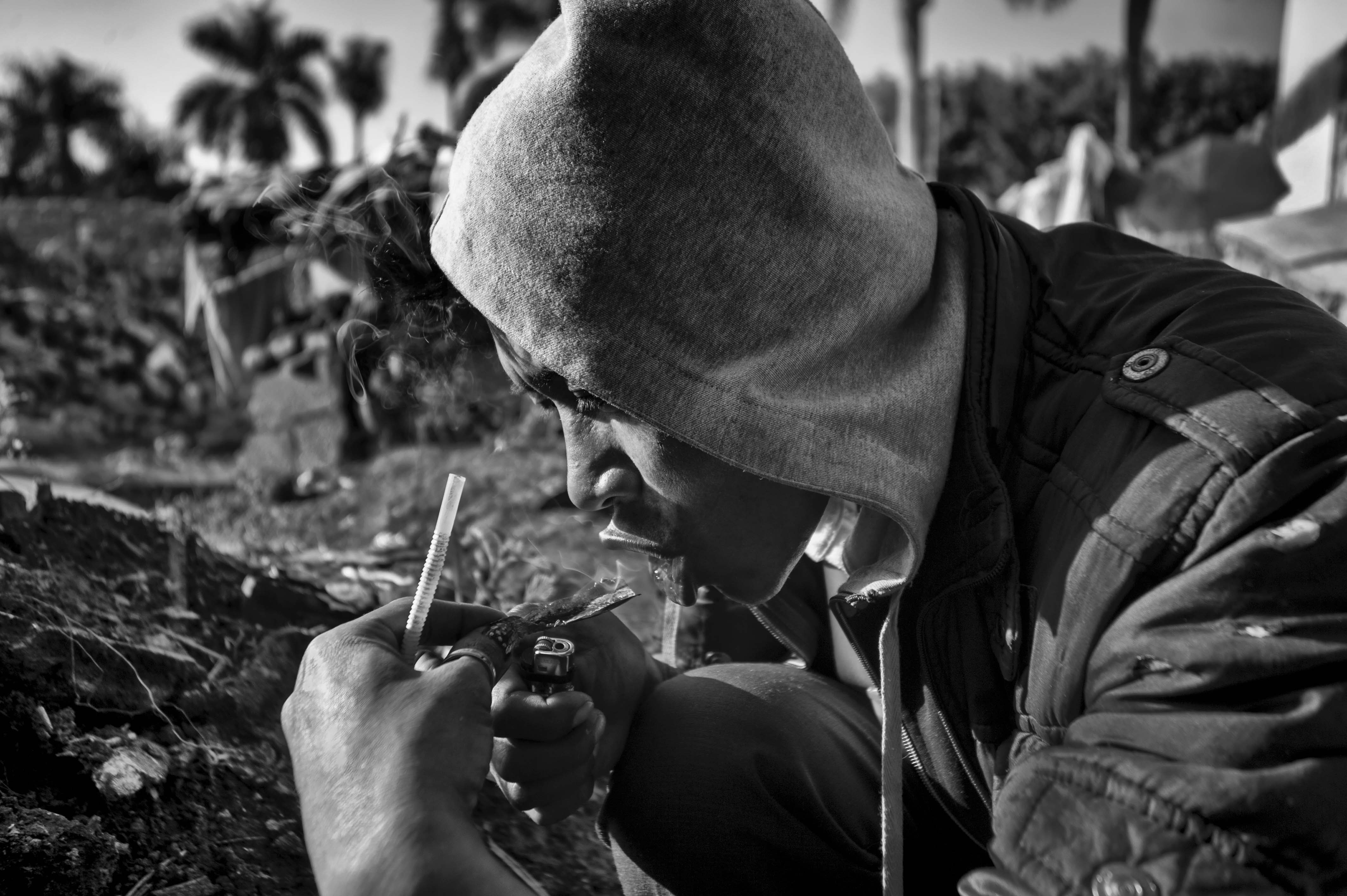 An ethnic Shan man smokes heroin in the Chinese border town Ruili. The illicit drug market and abundant natural resources in northern Burma is partly responsible for the various ongoing conflicts.